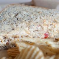 Pimento Cheese Sandwich · Pimento cheese and mayonnaise on seeded bread. Contains pecans.