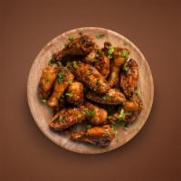 Traditional Bone-In Wings (10 Pcs) · 10 Traditional, bone-in, breaded jumbo chicken wings comes with your choice of 1 wing sauce ...