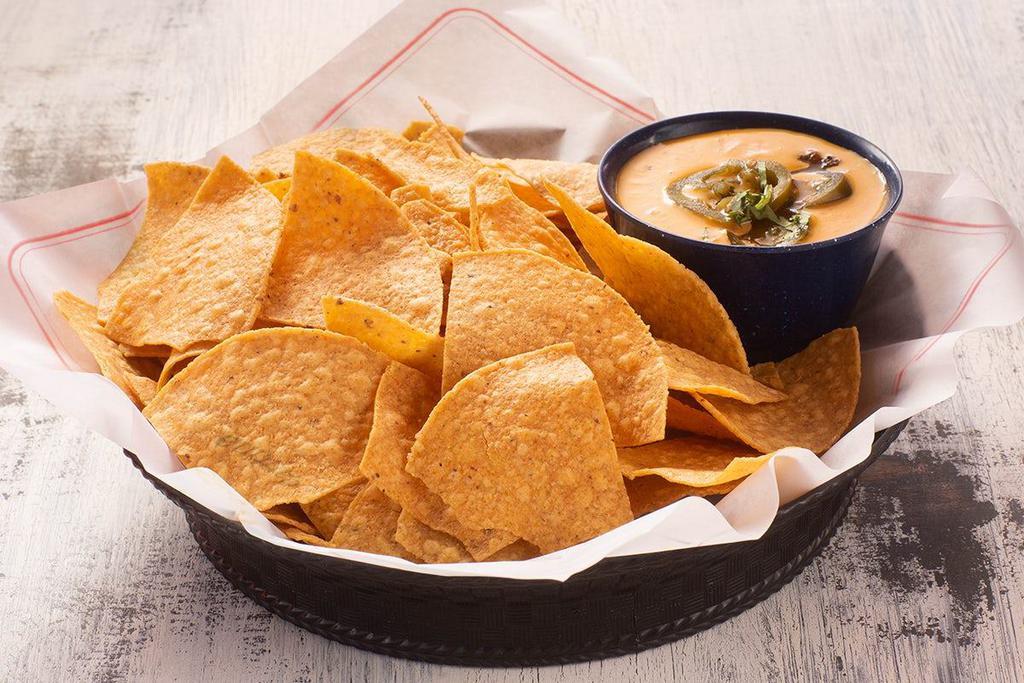 Chips Y Chipotle Queso · chips y spicy jack chipotle queso.