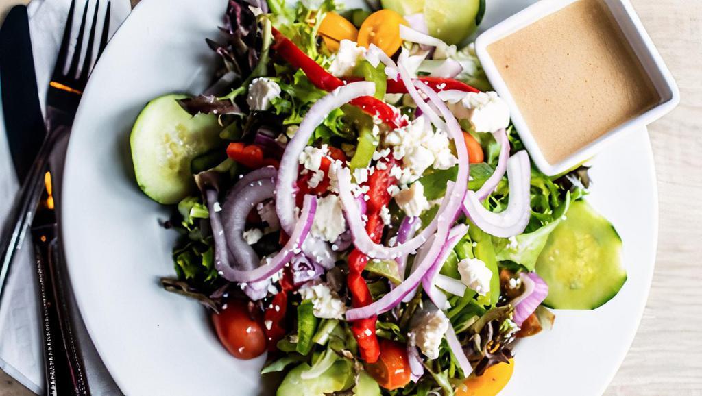 Greek  · Mixed greens, romaine, feta, Kalamata olives, cucumber, tomato, bell pepper and red onion. Served with Greek vinaigrette