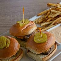 Crispy Chicken Sliders · Three breaded chicken sliders topped with American cheese, served with honey mustard and sho...