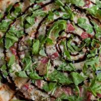 Prosciutto & Goat Cheese · Garlic cream sauce, prosciutto, caramelized onions and goat cheese. Finished with lemon bals...