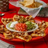 Primo Nachos · Choice of 1 primo meat with refried beans, Mexican cheese, beans, tomatoes, sour cream, guac...