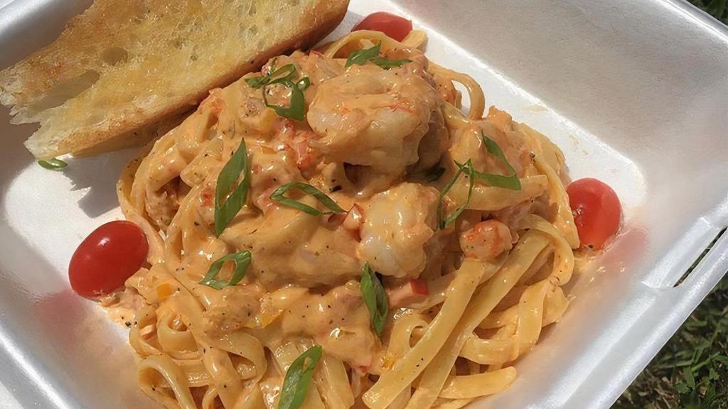 Cajun Pasta · Sautéed Shrimp and Crawfish Tails in Cajun Alfredo sauce,  Rich Parmesan and fettuccine noddles. Served with warm French bread toast