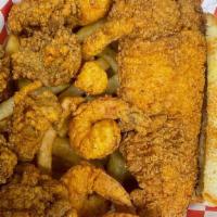 Seafood Combo Platter · Comes with 1 Fried Louisiana Catfish, 6 Fried Shrimp, 6 Fried Oysters Texas Toast and Fries