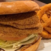 Catfish Sandwich · Fried catfish filet, lettuce, tomato, onion, pickle, mayo & old bay seasoning.  Served with ...