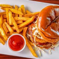 Western Burger · 8 ounces beef patty, bacon, cheddar cheese, fried onion rings, BBQ chipotle sauce and Mayo. ...