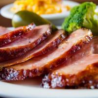 Smoked Ham Dinner · Smoked Honey Ham Topped With Our Homemade BBQ Sauce and Two Side Orders of Your Choice