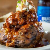 Bbq Baked Potato · Fresh Baked Potato Loaded With Butter, Cheese, Sour Cream, Bacon Bits and Green Onions. Topp...