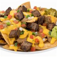 Loaded Nachos · Nachos made with our fresh Regio seasoned chips and your choice of the following meat: Chori...