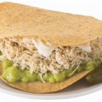 Tostada Siberia · A Chicken Tostada topped with Guacamole and Sour Cream. Served with a Pickled Jalapeño on th...