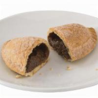 Cajeta Empanada · A Baked Pastry filled with Cajeta. Covered in a mixture of Cinnamon and Sugar.