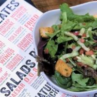 Side Salad · Mixed greens, tomato, cucumber.  Choice of dressing