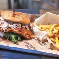 Nashville Hot Chicken Sandwich · Spicy fried breast, vinegar slaw over the top (served on side to go)
