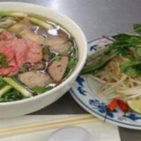 Steak & Meatball  Phở  / Tái, Bò Viên · Slices of eye-of-round steak, beef meatball, and rice noodle served with beef broth. Comes w...