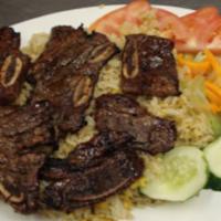 Korean Style Bbq Beef With Fried Rice / Cơm Sườn Bò Đại Hàn  · Grilled beef shorts ribs served with fried rice & fresh vegetables (tomatoes, cucumbers, ice...