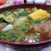 Caldo Tlalpeño (Chicken Soup) · Made with chicken, zucchini, potatoes, corn, and carrots, Monterey cheese, chipotle sauce, a...
