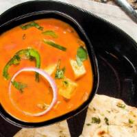 Paneer Tika Masala · Paneer in a creamy tomato curry with a blend of freshly ground herbs and spices. Served with...