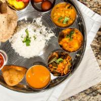 Vegan Special Thali · A vegan meal that includes 2 vegan vegetable curries, 1 vegan lentil curry, Vegan Appetizer,...