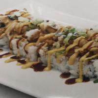 Volcano (Baked) · California roll topped w/ scallop, spicy crab with eel sauce,spicymayo