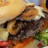 Carlos Angus Burger · Swiss Cheese and mushrooms french fries and hand-battered onion rings.