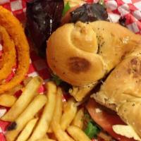 Courtney'S Grilled Chicken Sandwich · Grilled chicken breast french fries and hand battered onion rings.