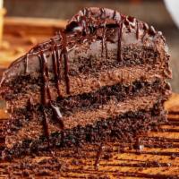 Chocolate Mousse Cake Slice · Layers of chocolate cake, dark chocolate and chocolate mousse.