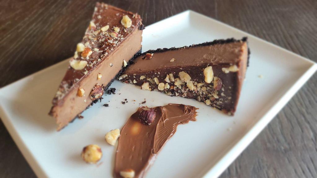 Nutella Cheesecake Slice · Contains Nuts. Nutella and cream cheese blend perfectly together yielding an indulgent cheesecake that isn't overly sweet.