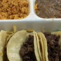 Taco Plate With Meat · 4 tacos with choice of meat served with rice & beans.