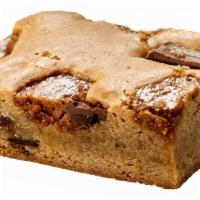 Toffee Crunch Blondie · Caramelized, dense & chewy butterscotch brownie stuffed with milk & semisweet chocolate chun...