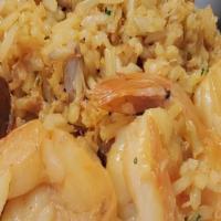 Arroz Con Jueyes Y Camaron · Yellow rice with Crab and Shrimp.