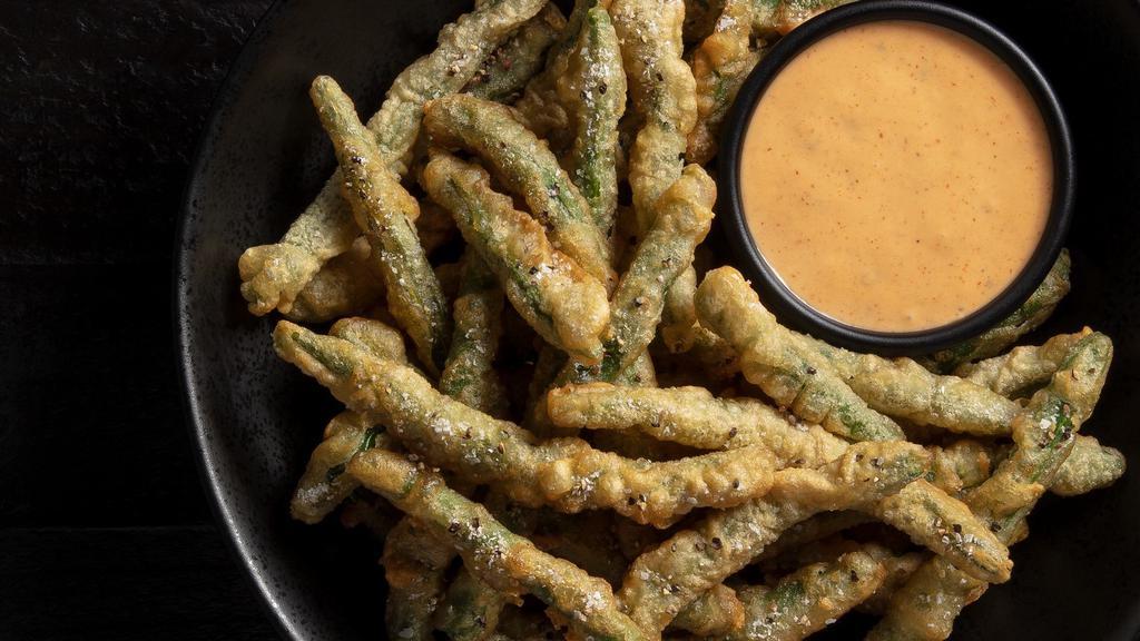 Crispy Green Beans · Tempura-battered, signature spicy dipping sauce. Platter serves 6-8. *These items are cooked to order and may be served raw or undercooked. Consuming raw or undercooked meats, poultry, seafood, shellfish or eggs may increase your risk of foodborne illness.