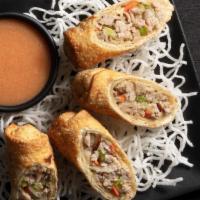 Pork Egg Rolls · Julienned veggies, sweet and sour mustard sauce. Platter includes 24 pieces. *These items ar...