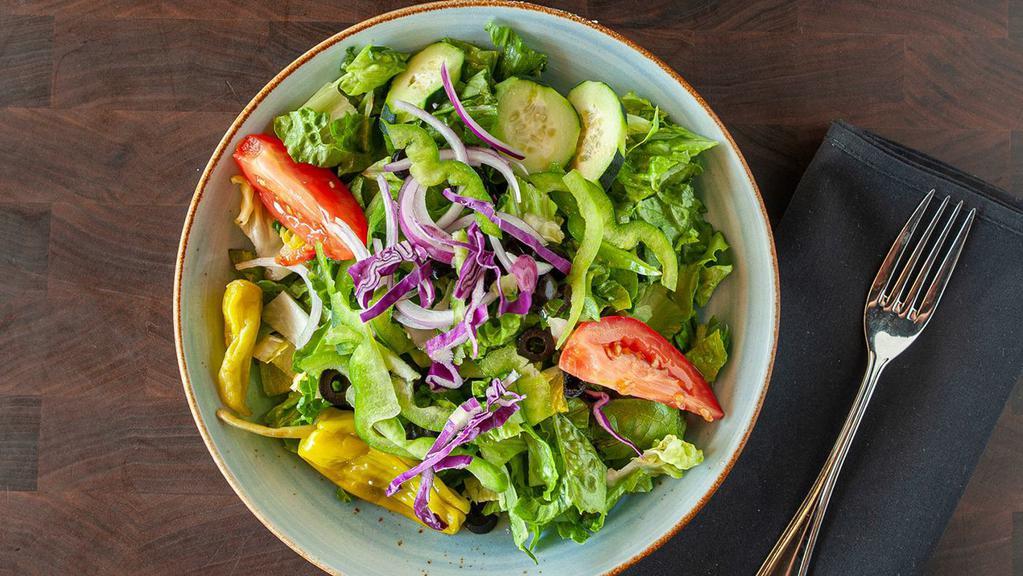 Small House Salad · Romaine lettuce, red onions, bell peppers, cucumbers, black olives, Roma tomatoes, red cabbage and your choice of dressing.