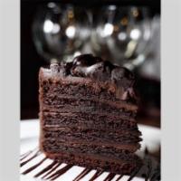 Truffle Chocolate Cake · Our colossal chocolate cake is crafted with layers of dark, moist chocolate and a silky truf...
