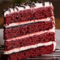 Red Velvet Cake · Red velvet cake layered with chocolate ganache filling, and frosted with a tangy cream chees...