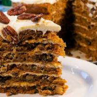 Carrot Cake · Studded with raisins, walnuts, and pineapple, finished with a smooth cream cheese icing. 540...