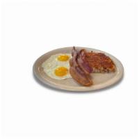 Norma'S Cafe Favorite · Two eggs, any style, with your choice of ham, bacon or sausage. Served with hash browns or g...