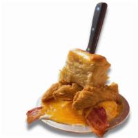 Cbgb · Crispy chicken tenders and bacon stacked over our homemade biscuit, scrambled eggs, hashbrow...