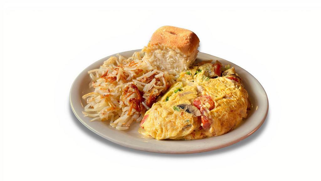 Veggie Omelet · Made with mushrooms, onions, bell pepper, tomato and Swiss cheese.