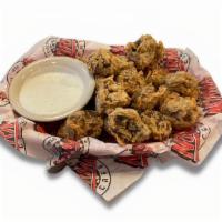 Fried Mushrooms · Mouth-watering mushrooms lightly battered and fried golden brown, served with homemade ranch...