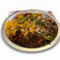 Chili Cheese Tots Or Fries · Tater tots or fries smothered in Texas Cafe chili topped with diced onions, jalapeños and me...
