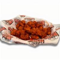 Buffalo Bites · Fresh chicken tenders cut bite-size then lightly battered in our special breading and served...