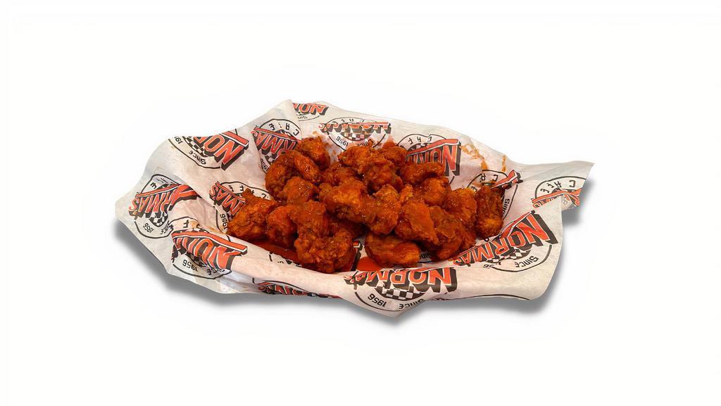 Buffalo Bites · Fresh chicken tenders cut bite-size then lightly battered in our special breading and served in buffalo sauce.