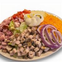Chef Salad · Smoked turkey and ham over crisp mixed greens with diced tomatoes, onions, boiled eggs, shre...
