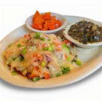 Monterey Chicken · Two juicy, tender chicken breasts smothered with green onions, mushrooms and tomatoes, toppe...