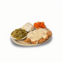 Chicken Fried Chicken · Our e-NORMA-us, award-winning chicken breast fried golden brown and smothered with cream gra...