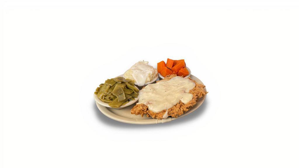 Chicken Fried Chicken · Our e-NORMA-us, award-winning chicken breast fried golden brown and smothered with cream gravy. Served with your choice of three fresh made veggies and Norma's Cafe's homemade rolls and cornbread.