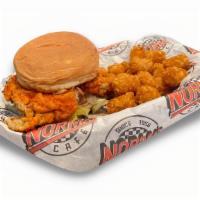 Buffalo Chicken Sandwich · Chicken fried chicken dipped in Norma's Cafe spicy buffalo sauce, served with lettuce, tomat...