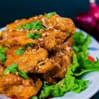 Chicken Wings · Hot and spicy. Marinated chicken wings deep-fried then sauteed in your choice of sweet chili...